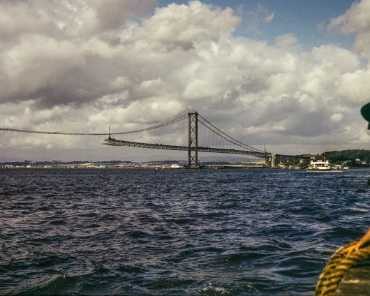 Ferry and Forth Road Bridge This image shows the Forth Road Bridge under construction in 1963. The photograph being taken from one of the ferries by the late John S. McCracken. Permission...